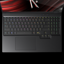 Load image into Gallery viewer, Aftershock X-16 Pro top-down view showing RGB backlit keyboard, numeric keypad, arrow cluster and large trackpad on dark.