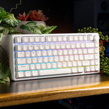 Load image into Gallery viewer, Aftershock White Kit tenkeyless white mechanical keyboard with RGB underglow, angled front view showing white keycaps.