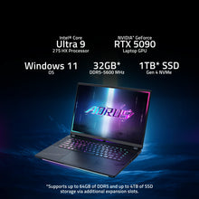 Load image into Gallery viewer, Gigabyte AORUS Master 16 BZH laptop three-quarter front view with RGB keyboard and illuminated AORUS logo on screen, dark.
